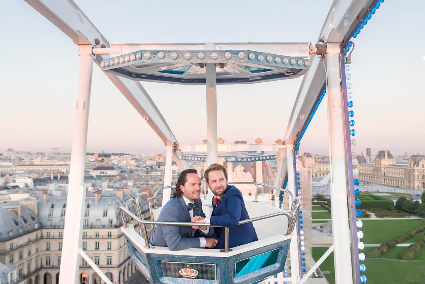 Romantic same-sex engagement photo session with the Parisian skyline backdrop. Photograph captured by famous NYC editorial photographer.